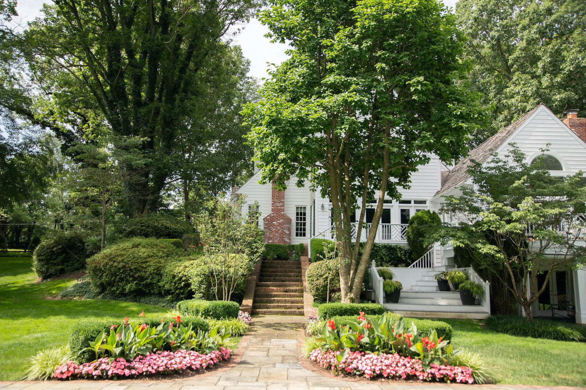 Spring landscaping with blooming flowers and green grass Reston Leesburg Northern Virginia